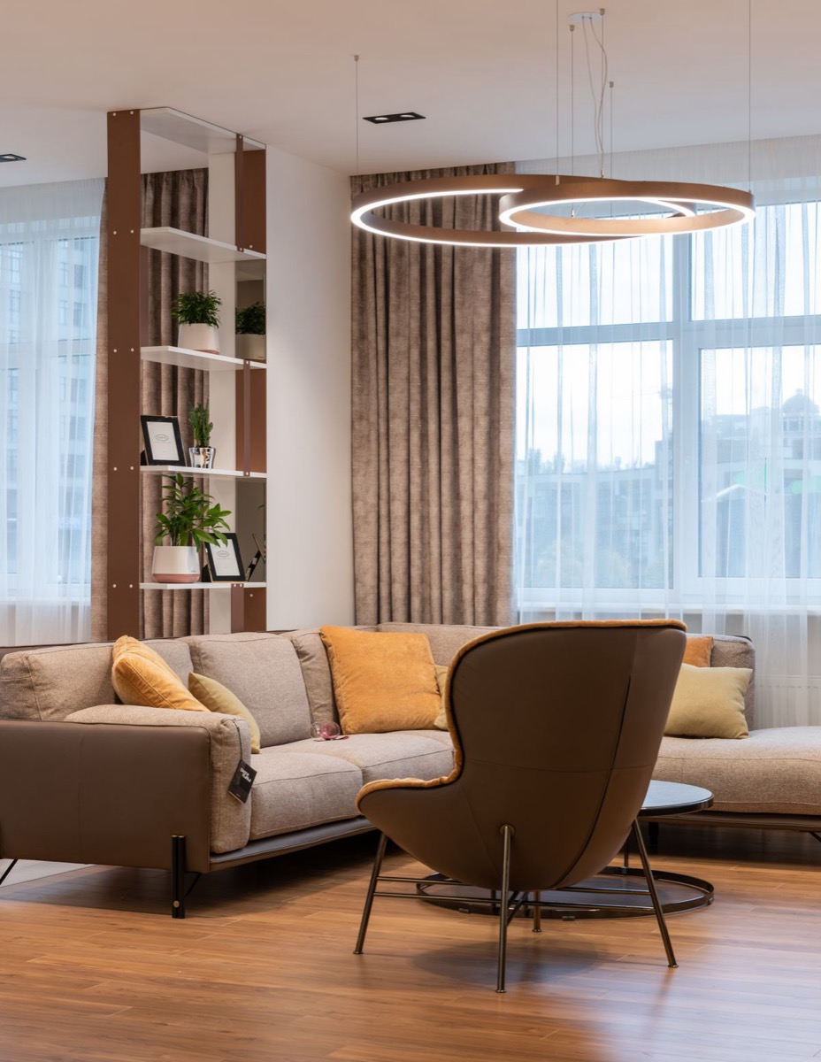 A sculptural accent chair in a warm minimalist interior