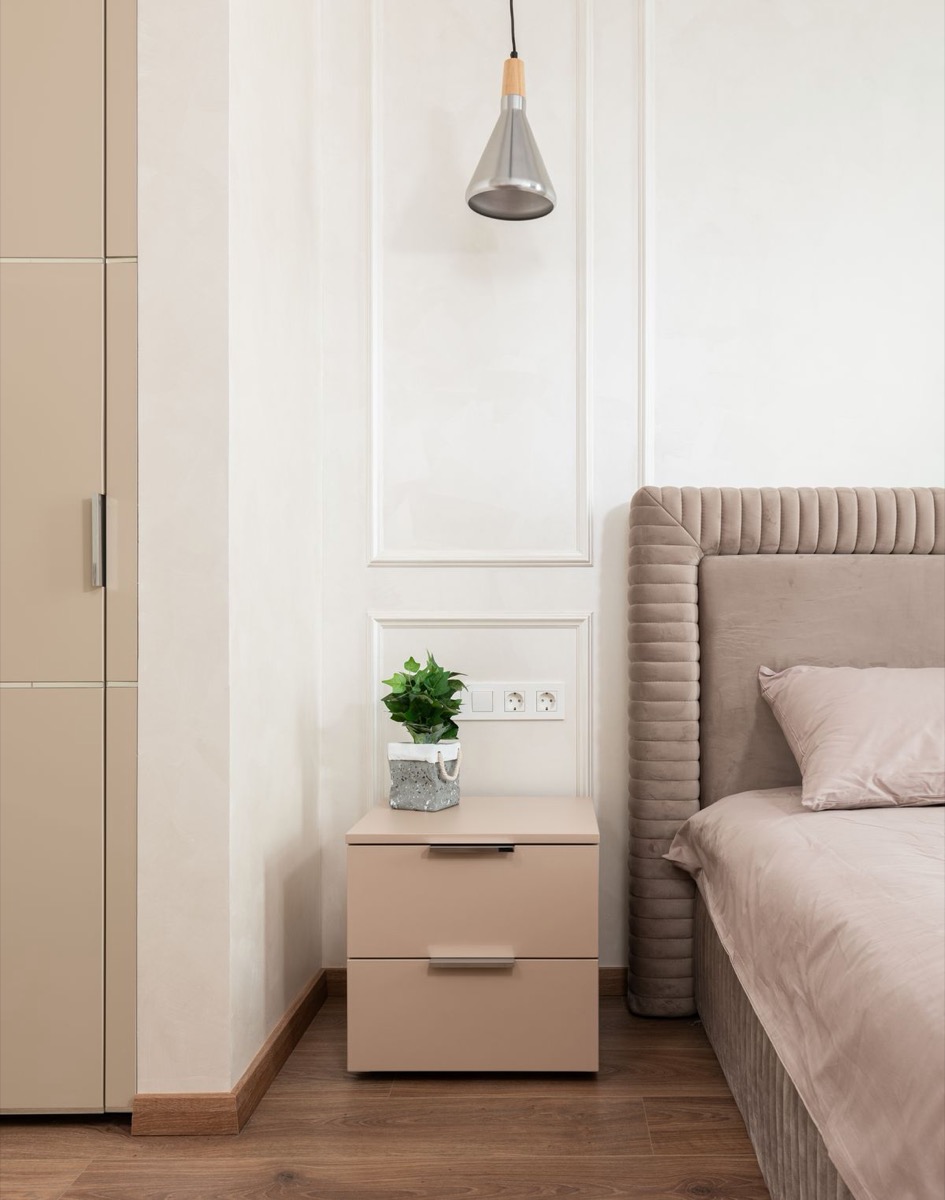 A restful bedroom with neutral textiles and natural materials