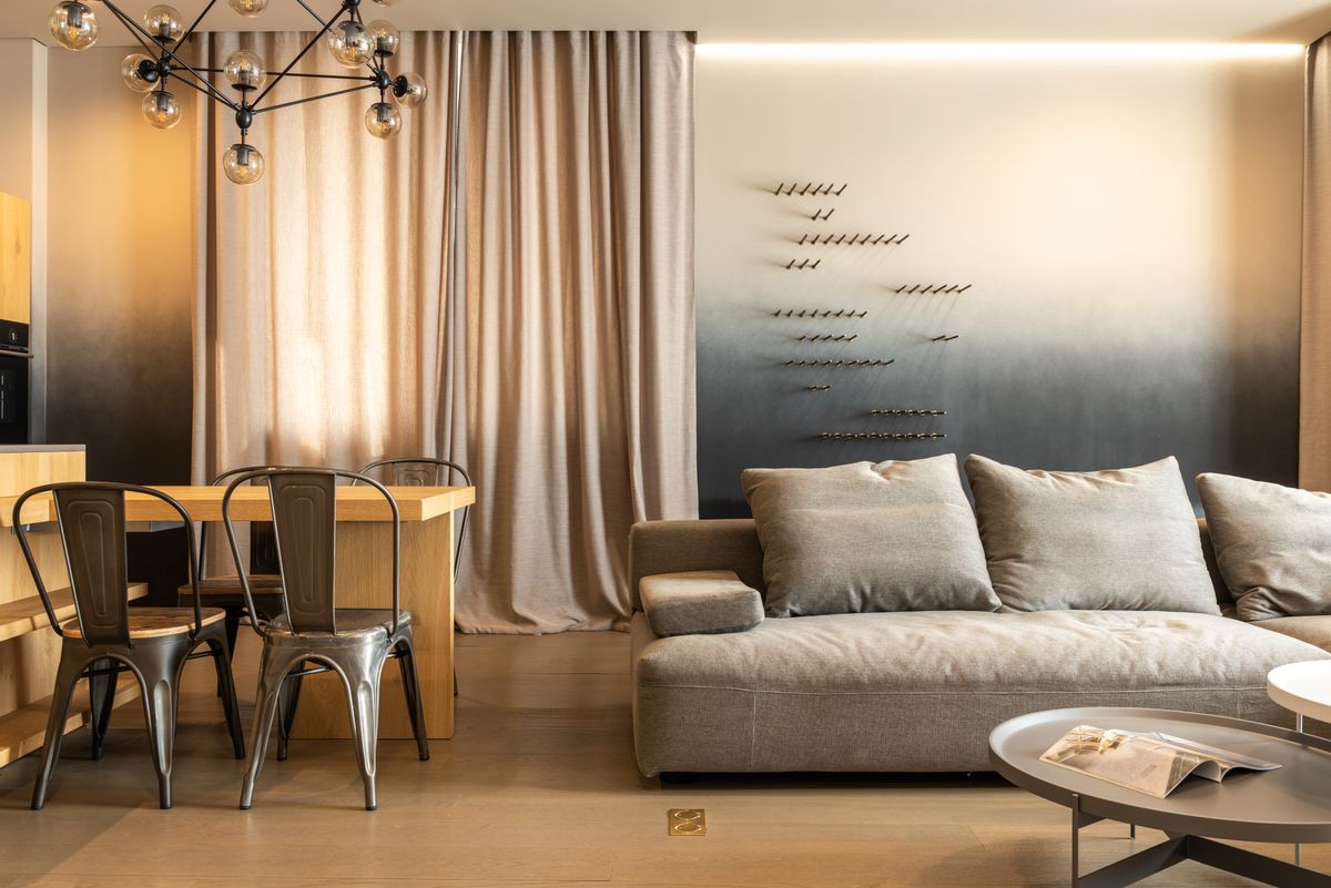 Warm modern living room with a sofa and wooden coffee table